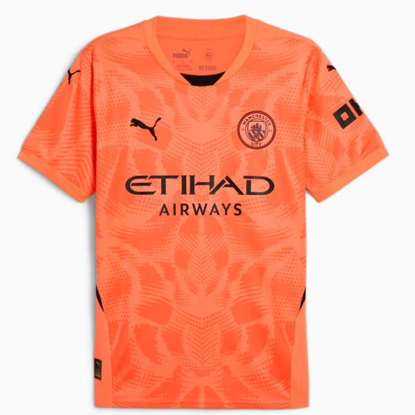 Bright orange Manchester City football jersey with Etihad Airways sponsor, Puma logos, and an abstract patterned front view.