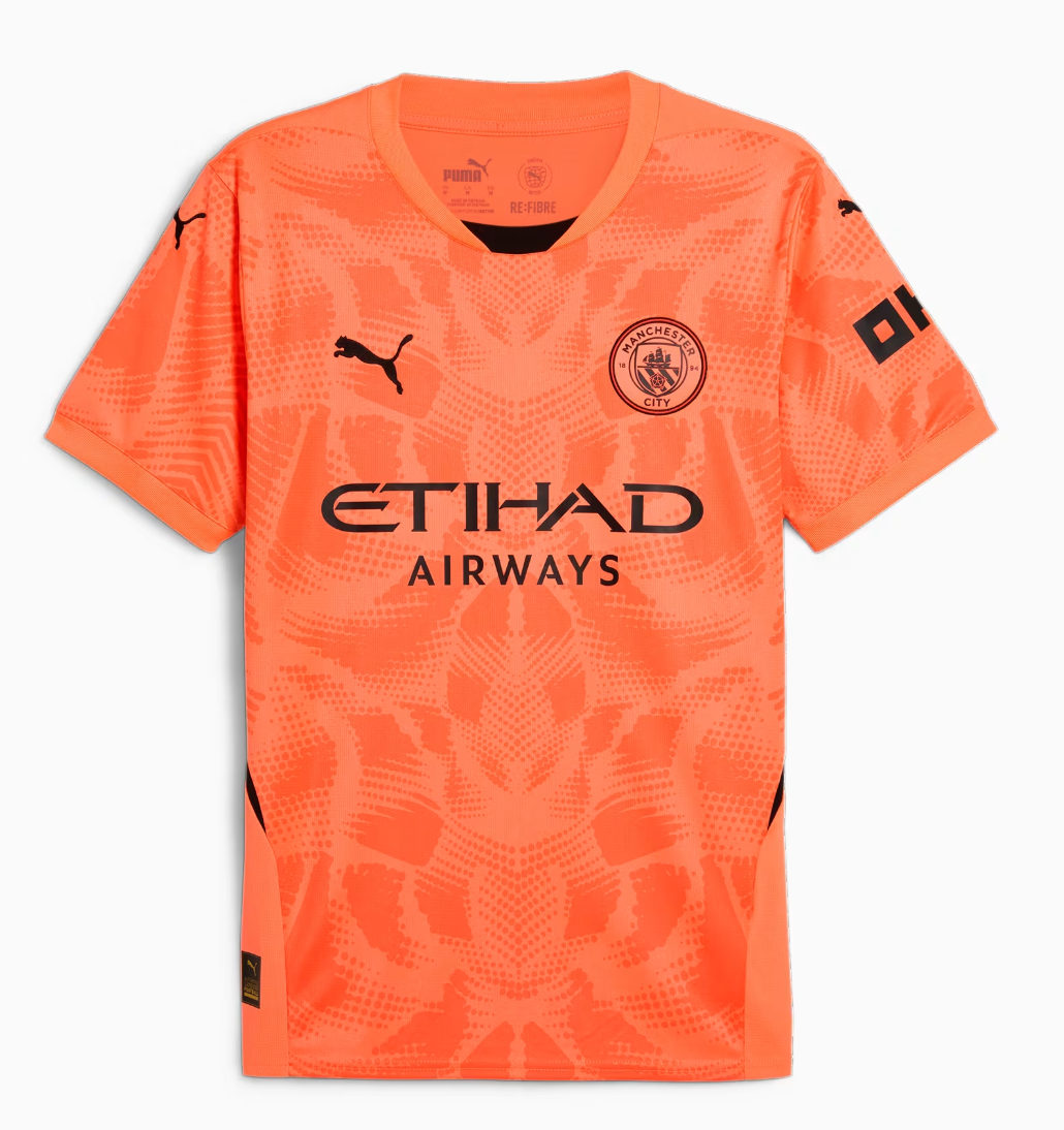 Screenshot2024-09-04185108 Bright orange Manchester City football jersey with Etihad Airways sponsor, Puma logos, and an abstract patterned front view.