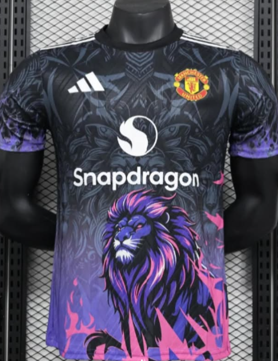 Screenshot2024-12-10185756 | UAE SPORT STORE Manchester United football jersey featuring a purple-pink lion graphic and Snapdragon sponsor logo on a dark patterned shirt.