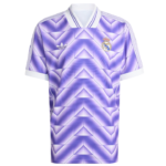 Purple Real Madrid Adidas football jersey with a geometric pattern, white collar, white sleeve cuffs, Adidas logo on left chest and Real Madrid crest on right chest.