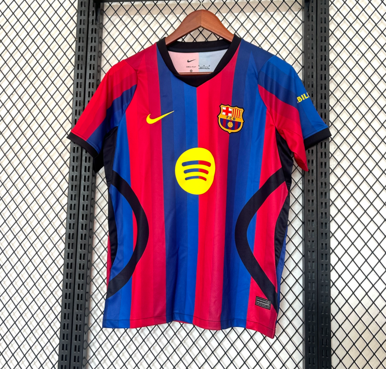Screenshot2026-01-24at12.31.15-768x735-1 | UAE SPORT STORE Barcelona football jersey with red and blue vertical stripes, Nike swoosh, and Spotify sponsor logo on the chest, hanging on a rack.