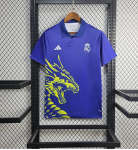 Screenshot_2024-06-24_205922 | UAE SPORT STORE Blue Real Madrid polo with yellow dragon graphic on the front left, Adidas logo and crest visible on chest.