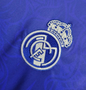 Screenshot_2024-06-24_205933 | UAE SPORT STORE Embroidered Real Madrid crest patch on blue fabric.