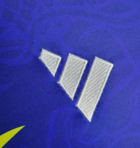 Screenshot_2024-06-24_205939 | UAE SPORT STORE Close-up of three white stitched bars on blue fabric