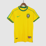 Yellow Brazil national team soccer jersey with green trim, Nike swoosh, and crest with stars on the chest.