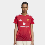 Female model wearing a red Manchester United football jersey with Snapdragon sponsor, front view against a light background.