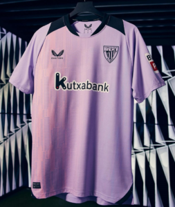 Lilac soccer jersey on a hanger with black shoulder panels, featuring Kutxabank sponsor and Athletic Bilbao crest on the chest.