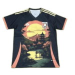 Navy soccer jersey with cream shoulder stripes and peach trim, featuring a large sunset garden scene (pagoda and bridge) across the front and a Japan crest on the left chest.