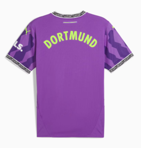 Purple Borussia Dortmund jersey back with lime-green 'DORTMUND' curved text, camo sleeves, zebra-stripe collar, and small PUMA logos.