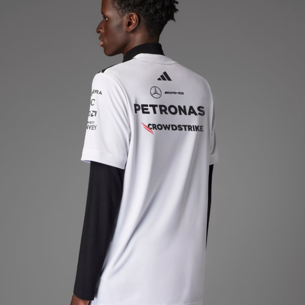 Back view of a person wearing a white racing jersey with PETRONAS, CLOUDSTRIKE, Mercedes-Benz, AMG, and Adidas logos visible on the back.