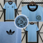 Screenshot_2025-05-10_001310 | UAE SPORT STORE Collage of a light-blue Adidas football jersey from multiple angles, showing black-trim collar, Adidas logo, and the German Football Association crest.