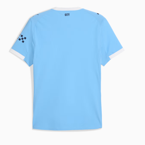 Light blue soccer jersey back view with white collar and cuffs; 'CITY' at the neck and a black checker pattern on the left sleeve.