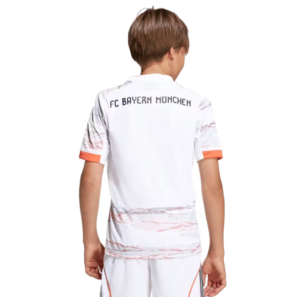 Back view of a child wearing a white FC Bayern München soccer jersey with orange sleeve cuffs and a marbled pattern around the midsection.