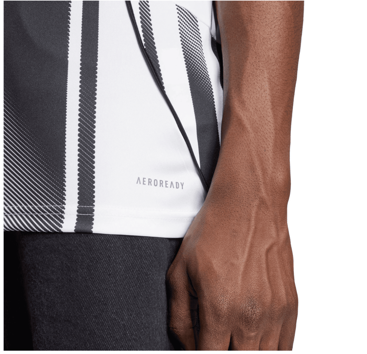 Close-up of a dark-skinned arm beside a white athletic shirt with black vertical stripes and the AEROREADY logo.