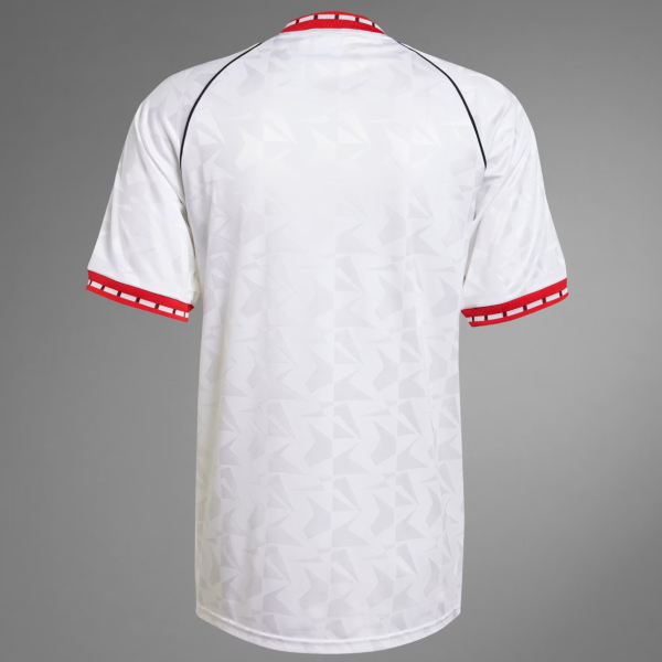 Back view of a white geometric-patterned sports jersey with red trim on the collar and sleeve cuffs, no branding visible.