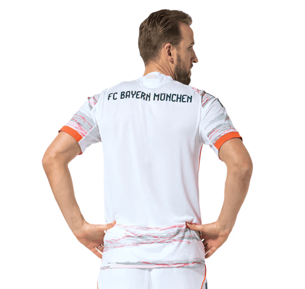 Back view of a man wearing a white FC Bayern Munich football jersey with orange trim on sleeves and hem, hands on hips.