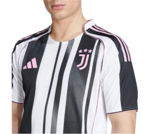 Close-up of a man wearing a white and black striped soccer jersey with pink trim, featuring the Juventus badge with three pink stars on the left chest and a pink Adidas logo.