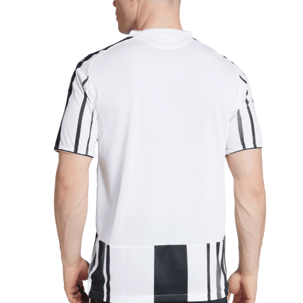 Back view of a person wearing a white athletic jersey with black vertical stripes on the sleeves and hem