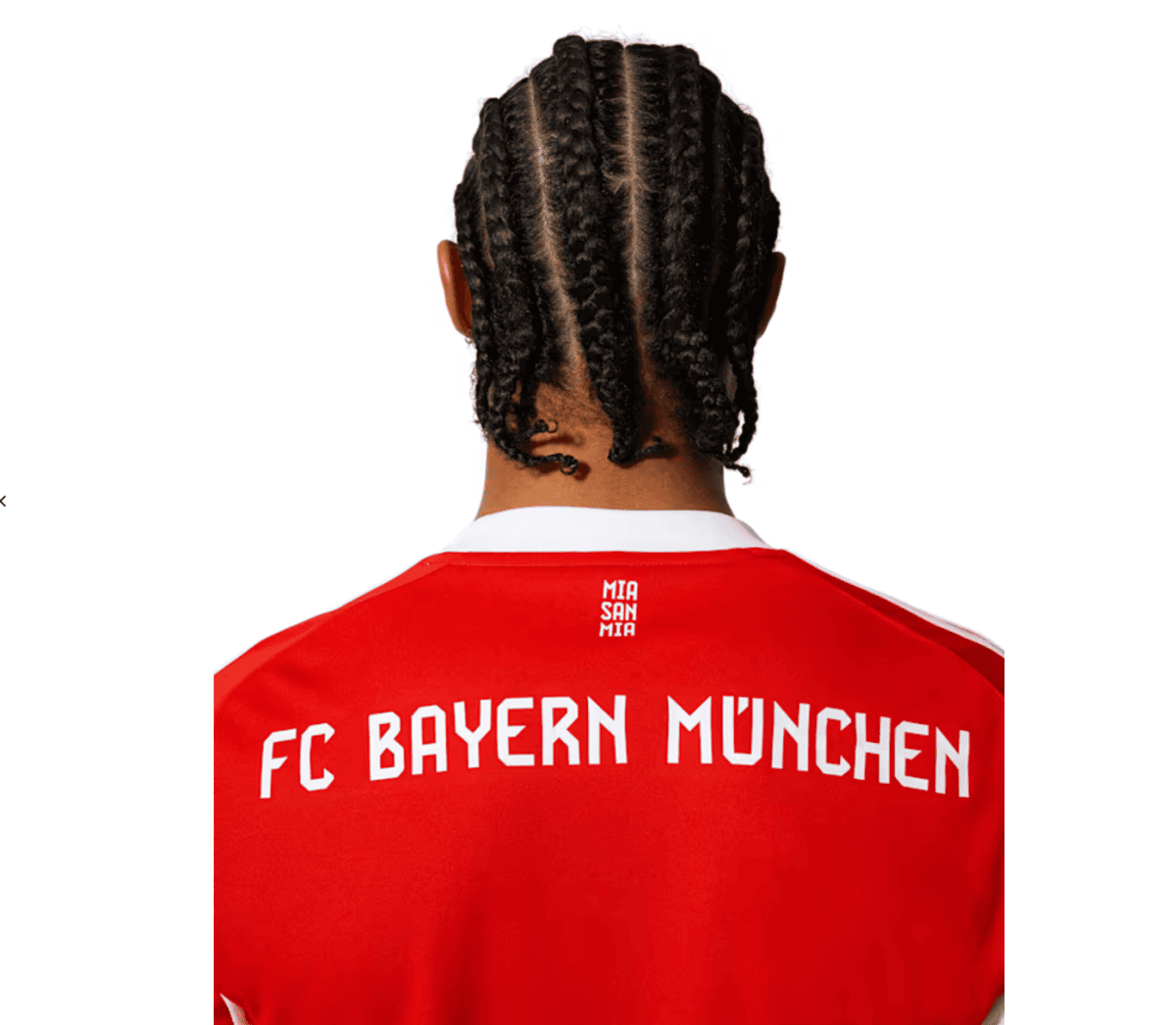 Back view of a person with braided hair wearing a red FC Bayern München jersey; small MIA SAN MIA text at the collar.
