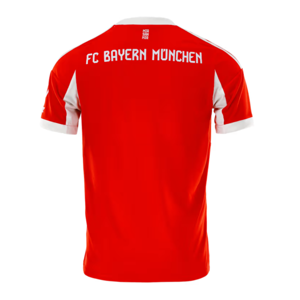 Back view of a red FC Bayern Munich jersey with white accents and 'FC BAYERN MÜNCHEN' text across the shoulders/upper back