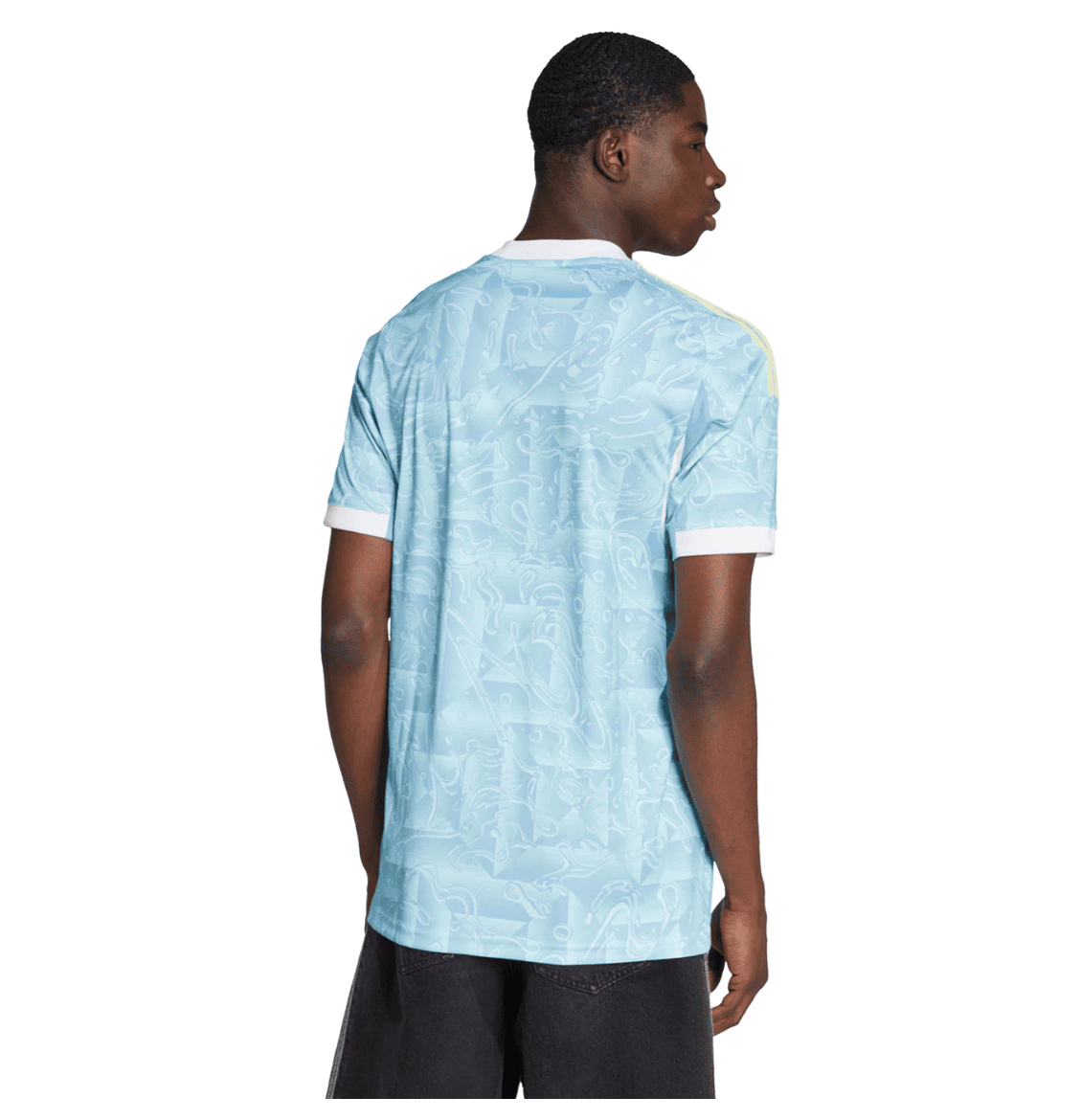 Screenshot_2025-06-23_195444 | UAE SPORT STORE Young man shown from the back wearing a light blue patterned short-sleeve polo with white cuffs and collar edge