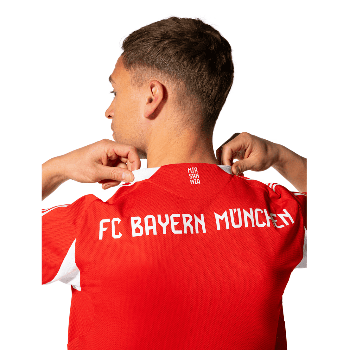 Back view of a person wearing a red FC Bayern München jersey, adjusting the white collar at the neckline.