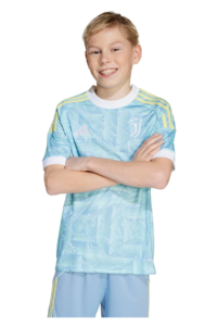 Smiling boy with arms crossed wearing a light blue Juventus soccer jersey against a white background.