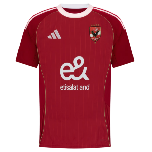 Front view of a red football jersey with white collar, vertical stripes, and a team crest on the left chest