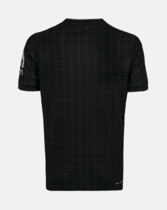 Black short-sleeve t-shirt with a subtle grid pattern, back view; small white logo on the left sleeve edge.
