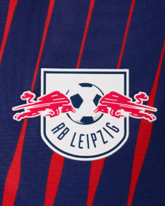 RB Leipzig crest patch with a soccer ball and two red charging bulls on a navy jersey with red stripes.
