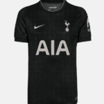 Black Tottenham Hotspur football jersey with a subtle grid pattern, white Nike swoosh, club crest, and large AIA sponsor across the chest.