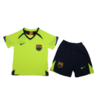 Neon yellow FC Barcelona soccer jersey with crest and Nike swoosh, paired with navy shorts featuring neon accents.