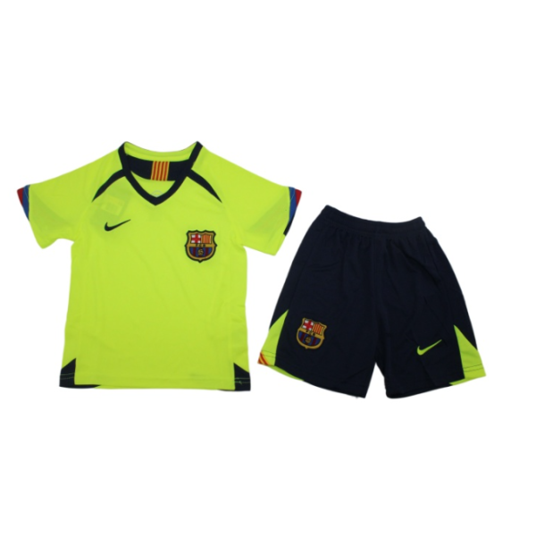 Neon yellow FC Barcelona soccer jersey with crest and Nike swoosh, paired with navy shorts featuring neon accents.