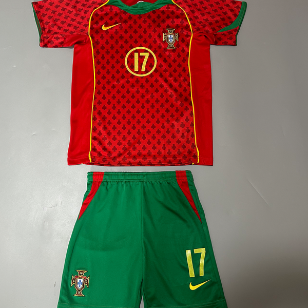 Portugal football kit: red patterned jersey with crest, green shorts, number 17, and yellow Nike swoosh.