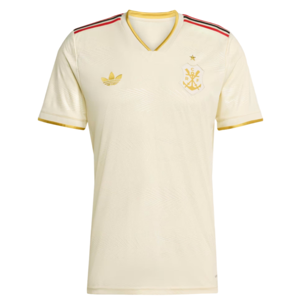 Cream soccer jersey with gold Adidas logo and crest on left chest, gold trimmed collar and sleeves, red/black shoulder accents, V-neck.