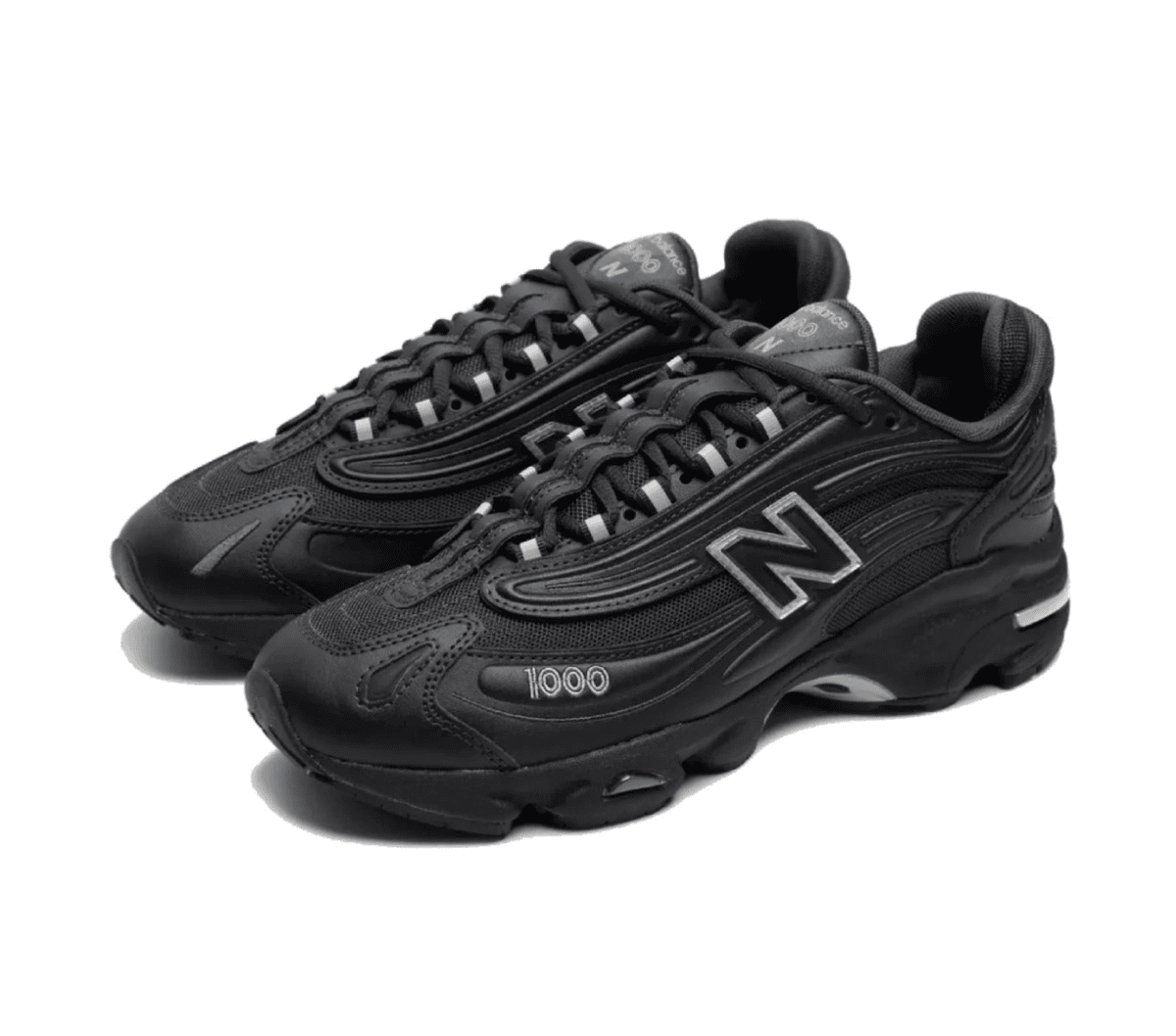 Black New Balance 1000 sneakers with a chunky sole and lace-up front on a white background, angled view.