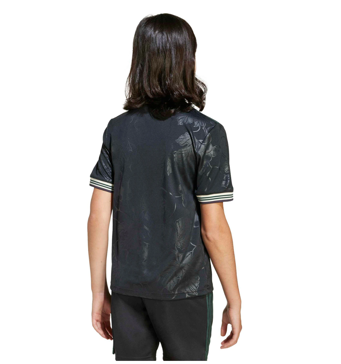Screenshot_2025-10-12_200010 | UAE SPORT STORE Person viewed from behind wearing a dark floral-patterned short-sleeve shirt and black shorts with green side stripes