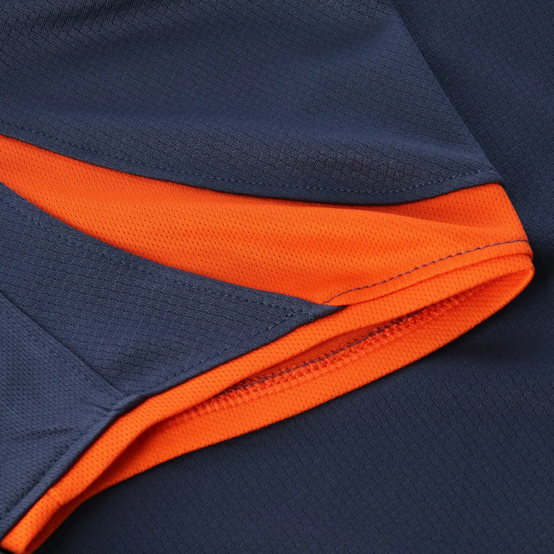 Screenshot_2025-10-12_200515 | UAE SPORT STORE Close-up of navy fabric with a bright orange inner seam and visible stitching edge.