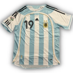 Argentina national football team jersey with light blue and white vertical stripes, number 19, crest, Adidas logo, and Copa America patch on the sleeve.