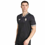Male model wearing a black floral-pattern polo shirt with striped collar and cuffs; Adidas logo on the chest.