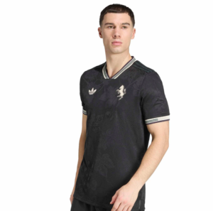 Male model wearing a black floral-pattern polo shirt with striped collar and cuffs; Adidas logo on the chest.