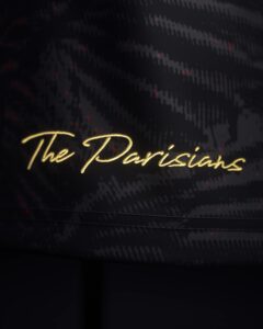 Signature_3000x_ab5a72a9-3119-46fd-8907-9ff607429d62 | UAE SPORT STORE Close-up of dark fabric with subtle wavy pattern and gold cursive text reading 'The Dutch' (decorative detail).