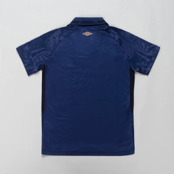 Navy blue polo shirt shown from the back with patterned sleeves and a small Umbro logo on the upper back near the collar.
