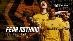 Four players in yellow team kits pose in a stadium; bold 'FEAR NOTHING' and '2024/25 HOME' text appears.