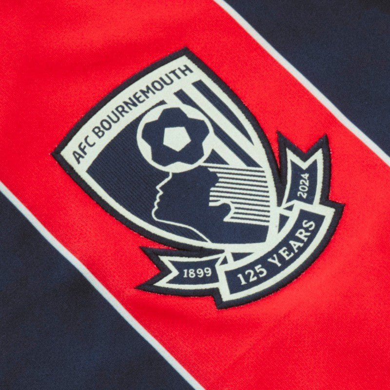 UKQke5DEhsgVkut | UAE SPORT STORE Close-up of an AFC Bournemouth crest patch on red and navy fabric, showing a stylized head with a football and 125 Years banner.