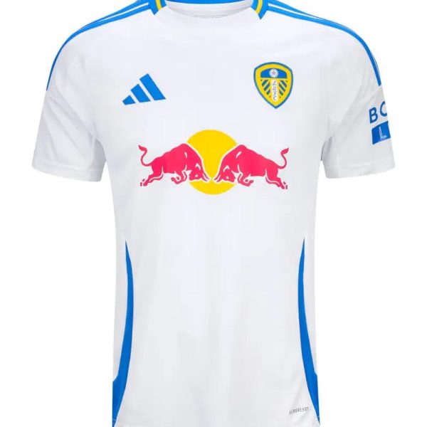 White Leeds United football jersey with blue trim and Red Bull sponsor logo on the chest, Adidas logo visible on the left.