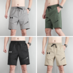 Gray athletic shorts with black drawstring and Under Armour logo on left leg, front view of pair worn by model in collaged image.