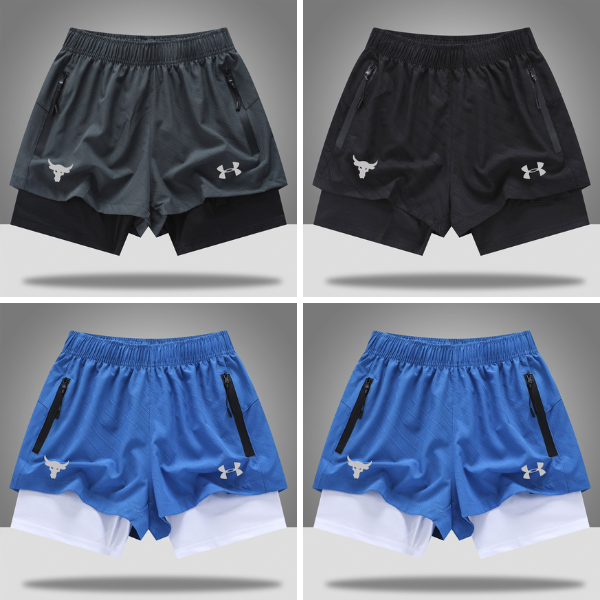Grid of four athletic shorts (two dark gray/black, two royal blue) with zip pockets and white logos; each pair shows a layered underlayer.