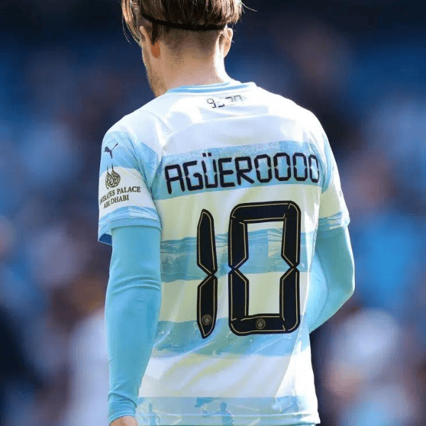 Untitleddesign-2022-06-09T051115.311_c6e651df-03d4-48d0-93c6-680ce8cee2ff | UAE SPORT STORE Back view of a soccer player wearing a light blue jersey with the number 10 on the back.