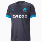 Dark gray Olympique de Marseille football jersey with blue accents; CAZOO sponsor on the chest, Puma logo, and OM crest visible.